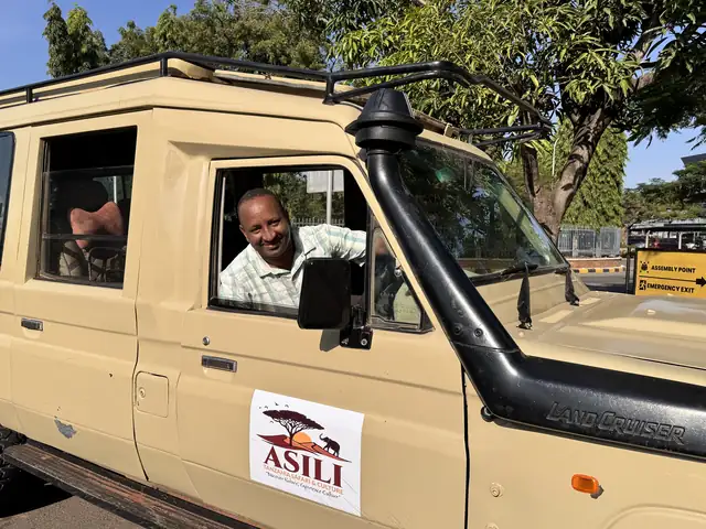 John at the wheel of an Asili safari vehicle