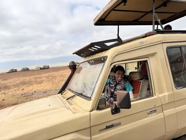 Kelvin smiling from the safari vehicle